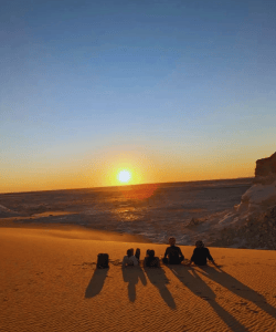 Visitors taking photos during a White Desert safari tour