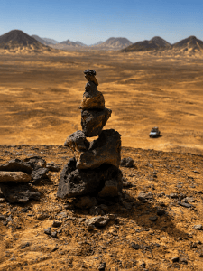 Desert cairn under bright sky
