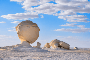 Desert rock formations under a blue sky