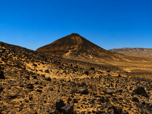 Desert volcanic landscape under clear sky