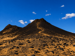 Volcanic desert under a blue sky